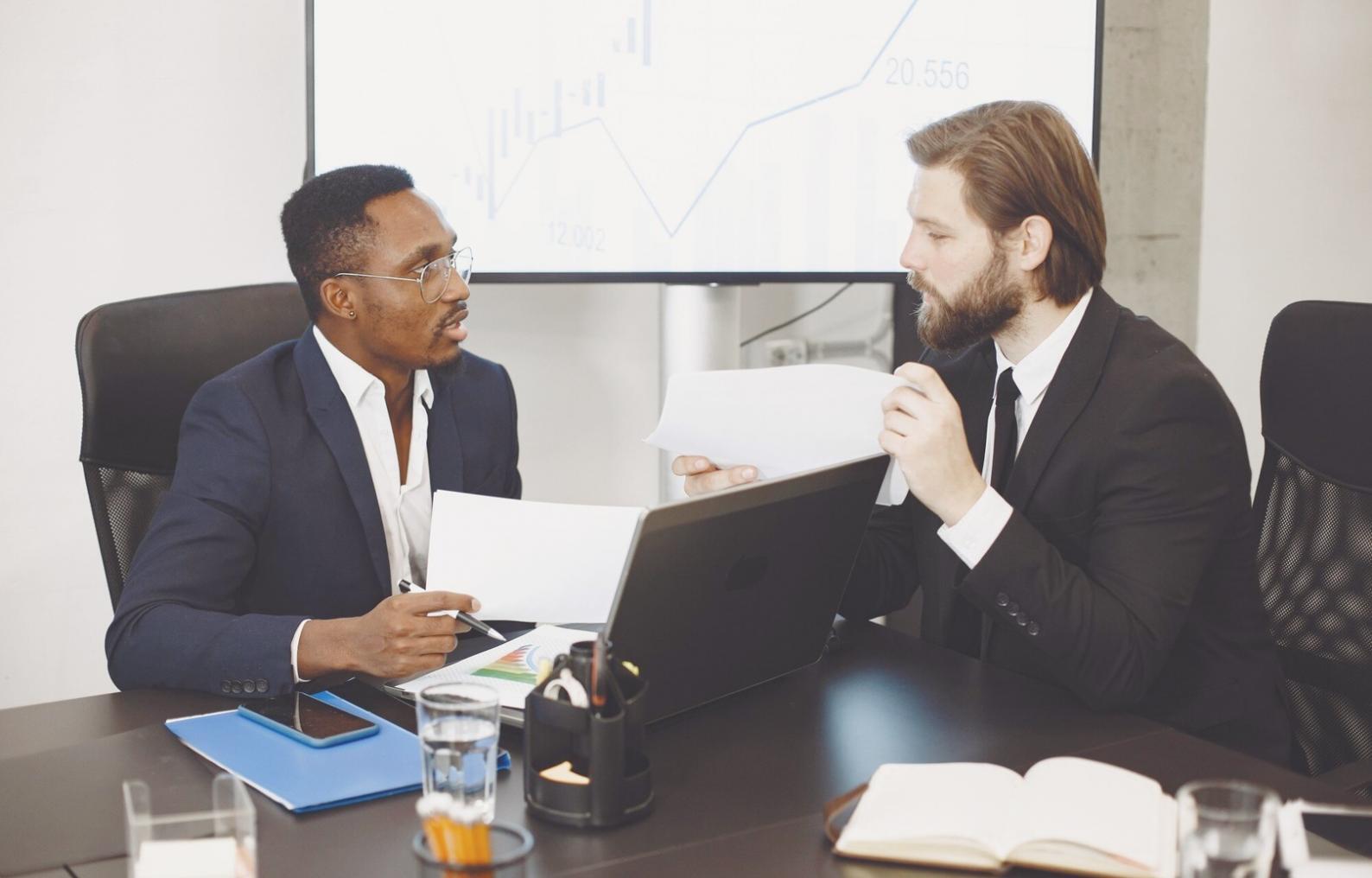 Financial analysis workspace with spreadsheets and calculator